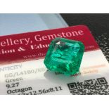 GREEN STONE WITH CARD MARKED EMERALD