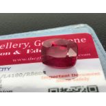 RED STONE WITH CARD MARKED RUBY