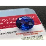 BLUE STONE WITH CARD MARKED SAPPHIRE