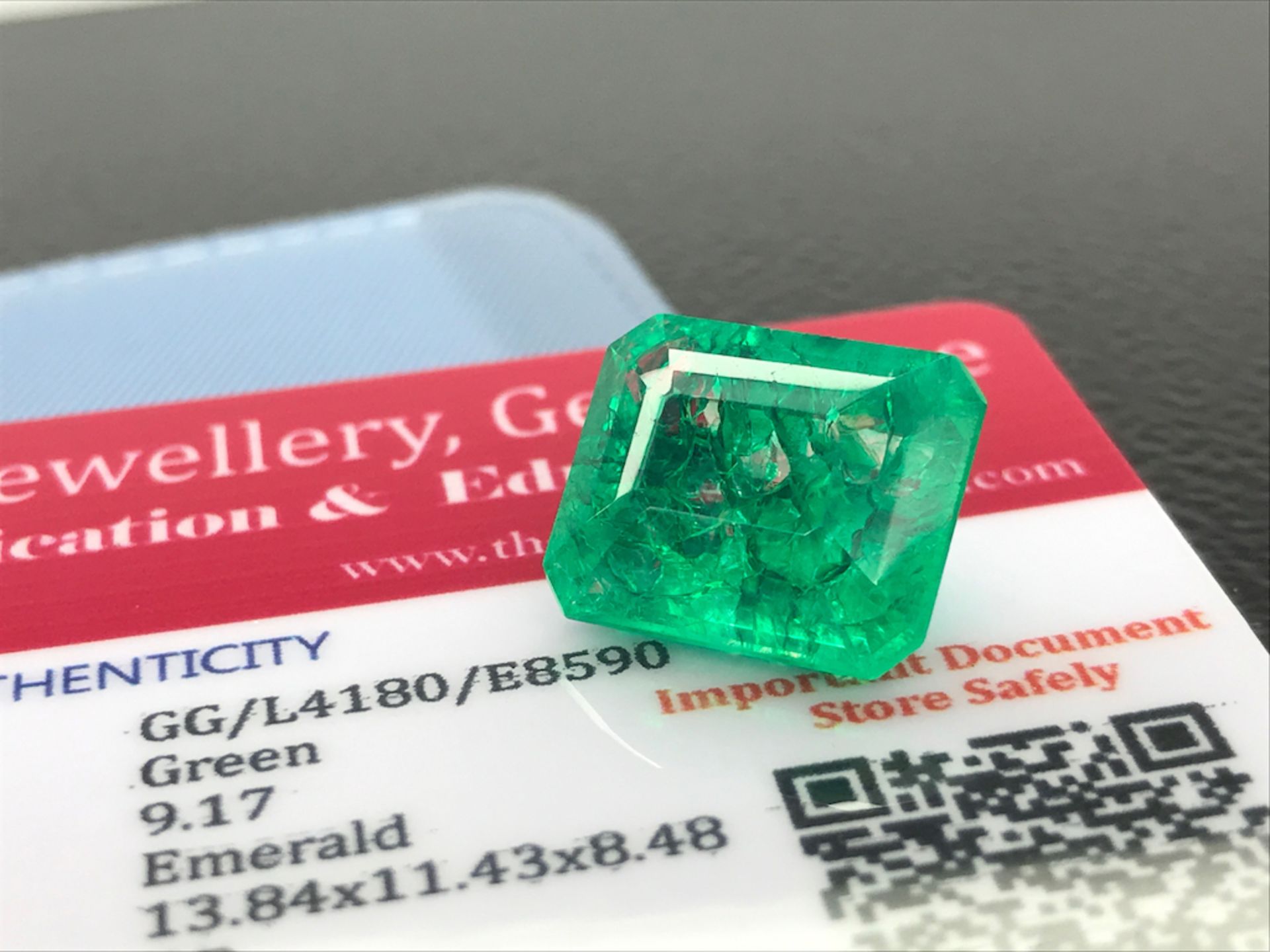 GREEN STONE WITH CARD MARKED EMERALD