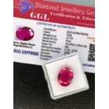 PINK STONE WITH CARD MARKED SAPPHIRE