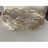 18ct GOLD DIAMOND SET PATTERNED HINGED BANGLE