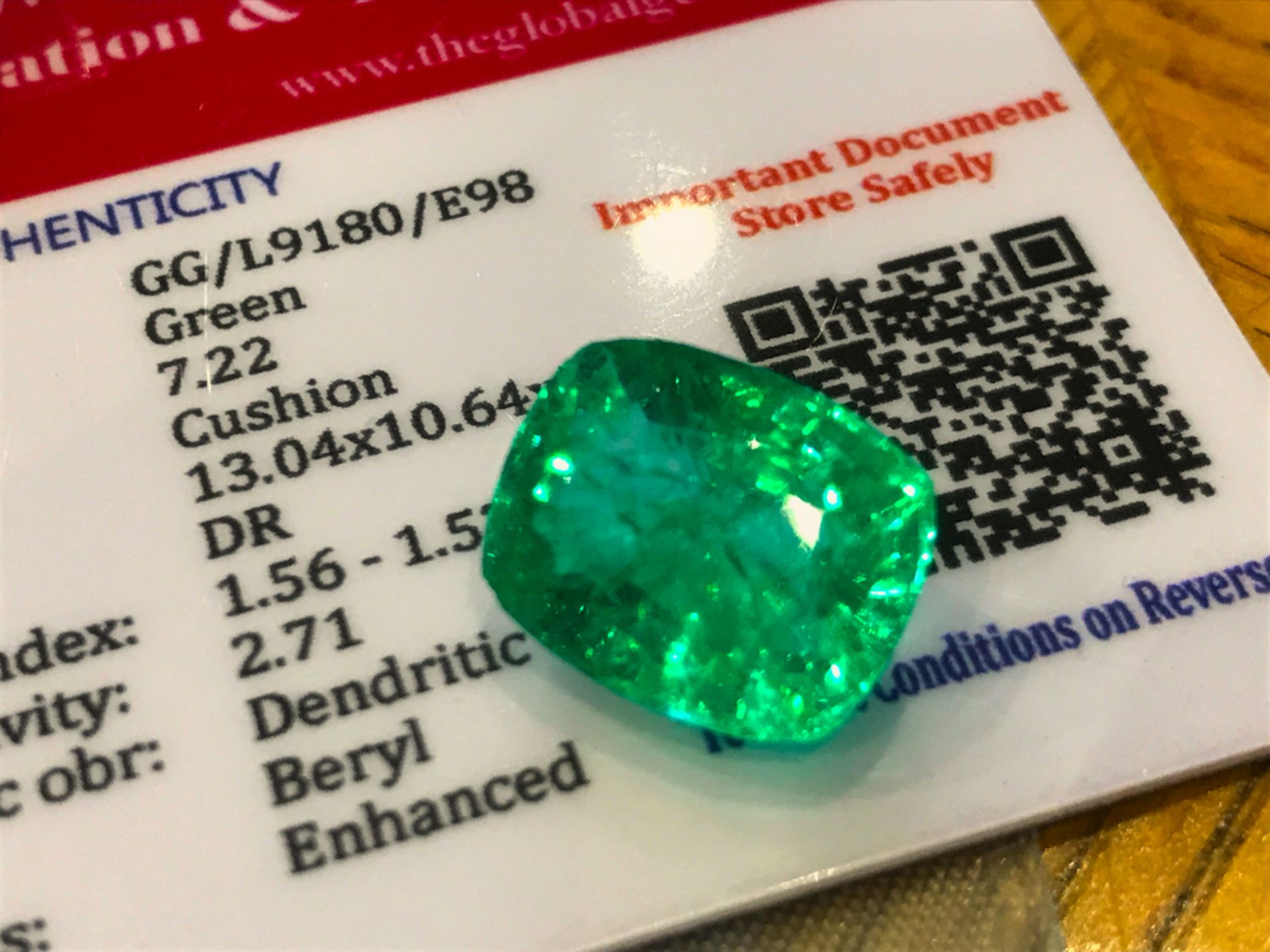 GREEN STONE WITH CARD MARKED EMERALD