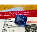 BLUE STONE WITH CARD MARKED SAPPHIRE