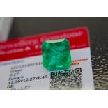 GREEN STONE WITH CARD MARKED EMERALD
