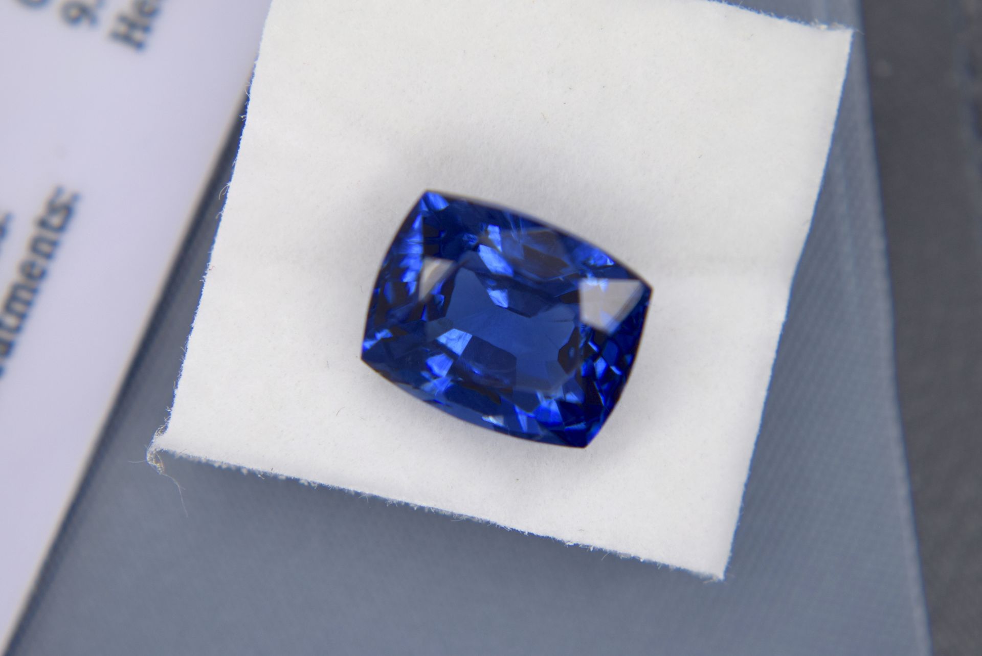 BLUE STONE WITH CARD MARKED SAPPHIRE