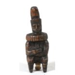 A figural carved wood snuff bottle in the form of a seated gentleman with a neck ruff. 12cm (4.75