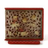 A Chinese cinnabar lacquer rectangular box with inset pierced jade panel to the top, 12.5cms (