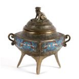 A Chinese bronze and champleve enamel censer on four splayed feet, with fo dog finial, 16cms (6.