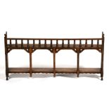 A 19th century walnut wall shelf with bobbin turned supports, 86cms (34ins) wide.
