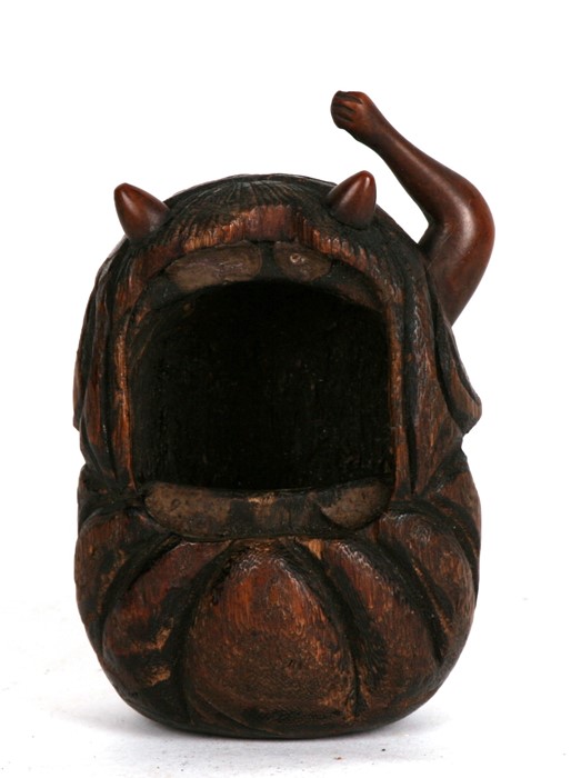 A Japanese Tobako-Bon wooden holder in the form of an Oni (missing face and one arm).