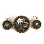 A 19th century yellow metal mounted pietra dura brooch, 4cms (1.5ins) diameter; together with a pair