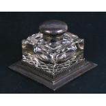 A silver mounted glass desk top inkwell, Sheffield 1912 and maker's mark for 'Walker & Hall',