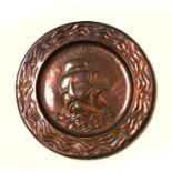 An Arts & Crafts style copper plaque with central three-masted ship and motto 'Ye Wooden Rules of