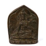 A Tibetan bronze figure of White Tara on a lotus base, with petal shape mandorla. Her head is