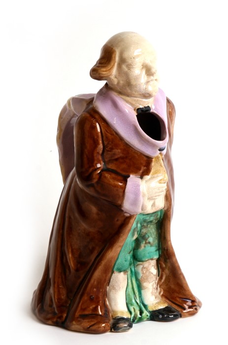 A 19th century figural majolica jug in the form of Mr Micawber, 28cms (11ins) high. - Image 2 of 2