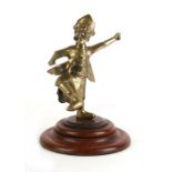 A Chinese polished bronze / brass figure in the form of a bearded man, mounted on a later hardwood