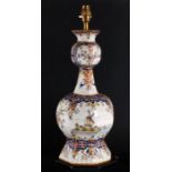 A large coloured Delft vase of octagonal bottle form, converted and fitted as a table lamp,