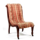 A Victorian walnut upholstered slipper chair.