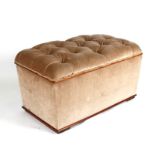 An upholstered ottoman, 81cms (31.75ins) wide.