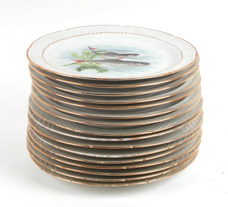 A quantity of Limoges plates, each decorated with fish, 23cms (9ins) diameter (12). - Image 2 of 2