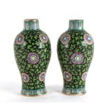 An unusual pair of 18th century Chinese style clobbered Delft vases, 17cms (6.75ins) high.