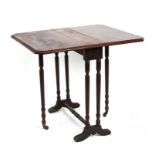 An Edwardian walnut Sutherland table on ring turned supports, 54cms (21.25ins) wide.