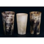 Three tapering horn beakers, the largest 11.5cms (4.5ins) high (3).