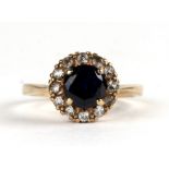 A 9ct gold cluster ring, approx UK size 'L'.