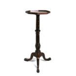 A mahogany candle stand, the octagonal top on turned column and tripod base, 28cms (11ins) wide.