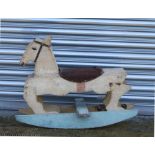 A child's vintage wooden painted rocking horse.
