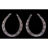 A pair of novelty napkin rings in the form of horseshoes, Sheffield 1966, 5cms (29ns) high (2).