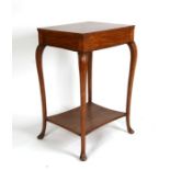 A walnut occasional table on cabriole legs, 47cms (18.5ins) wide.