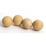Four 19th century miniature ivory billiard balls, 3cms (1.2ins) diameter.
