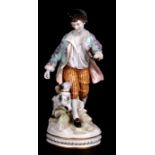 A Naples porcelain group depicting a young boy with a dog, 29cms (11.5ins) high.