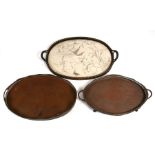 Two oval galleried silver plated trays, the largest 62cms (24.5ins) wide; together with a silk