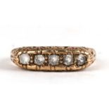 A 9ct gold ring set with five white stones, approx UK size 'O'.