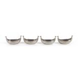 A set of four Just Andersen (Danish 1884-1943) pewter Viking longboat salts, 11cms (4.25ins) long.