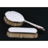 A silver and guilloche enamel hairbrush and matching clothes brush.
