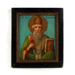 An antique Greek icon painted on panel depicting St Spiridon, overall 29 by 33cms (11.5 by 13ins).