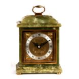 An Elliot mantle clock made for Garrard & Co., the silver chapter ring with Roman numerals, in a