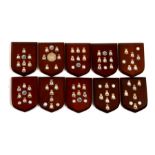 Ten wooden wall shields mounted with enamel Royal Air Force badges including Support Command,