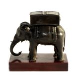 A Peter Hicks Associates bronzed resin figure of an elephant, copying one presented to the 8th