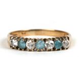 A 9ctr gold ring set with pale blue and white stones, approx UK size 'N'.