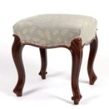 A Victorian walnut upholstered stool on cabriole legs.