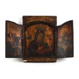 An antique Russian triptych icon depicting St George, St Michael and the Madonna with Child on the