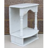 A carved alabaster two-tier wall shelf, 41cms (16ins) wide.