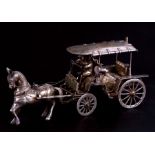 An Eastern white metal horse and carriage, 20cms (8ins) long, total weight 253g.