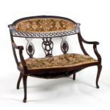 A late 19th century mahogany two-seater salon sofa with upholstered seat and back, on cabriole legs,