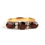 A 14ct gold garnet ring, approx UK size 'N'.